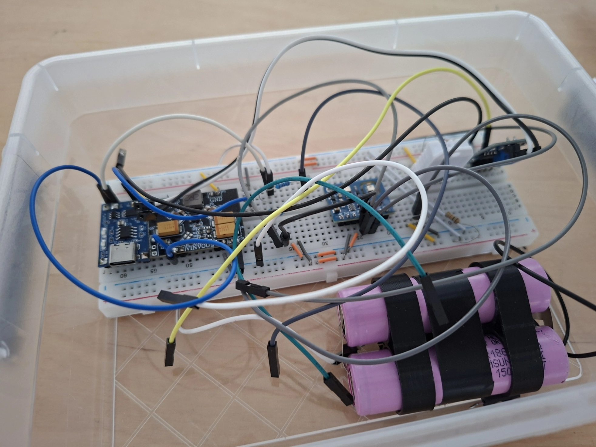 ESP32 breadboard prototype with two taped 18650 cells